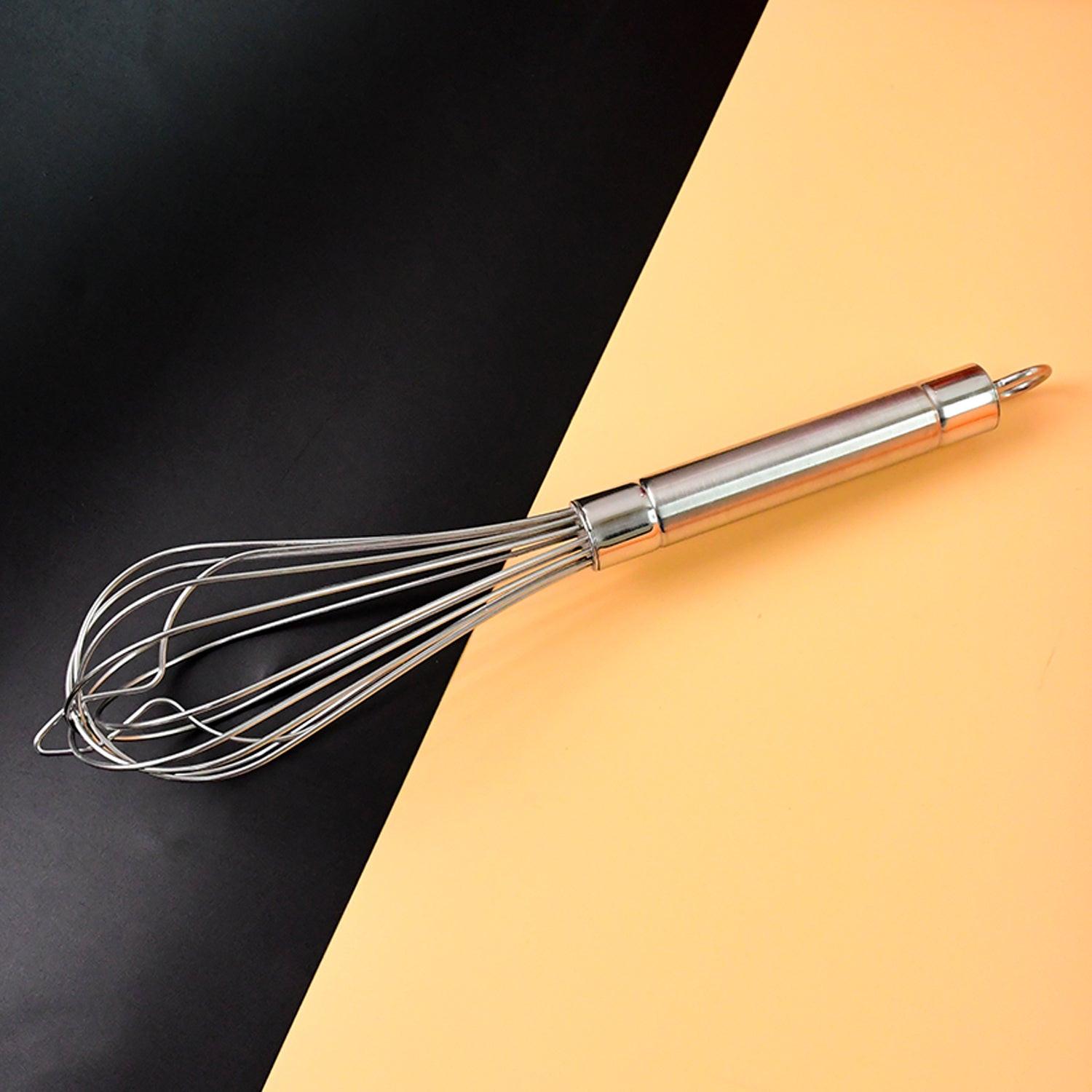 Stainless steel hand whisk with ergonomic handle for easy mixing in the kitchen