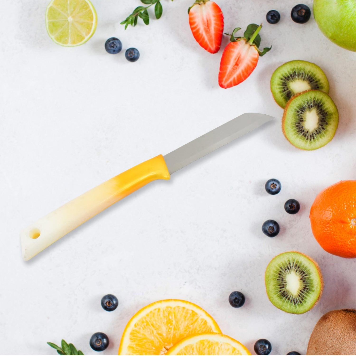 Superior eMart stainless steel kitchen knife on a countertop surrounded by fresh fruits