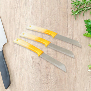 Set of three stainless steel kitchen knives with ergonomic yellow handles for easy cutting and slicing