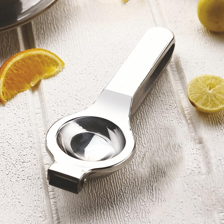 Stainless steel lemon squeezer with ergonomic handle for easy citrus juicing in the kitchen