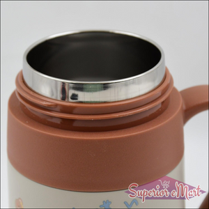 Close-up of a stainless steel vacuum insulated mug interior showing sleek design for optimal temperature retention