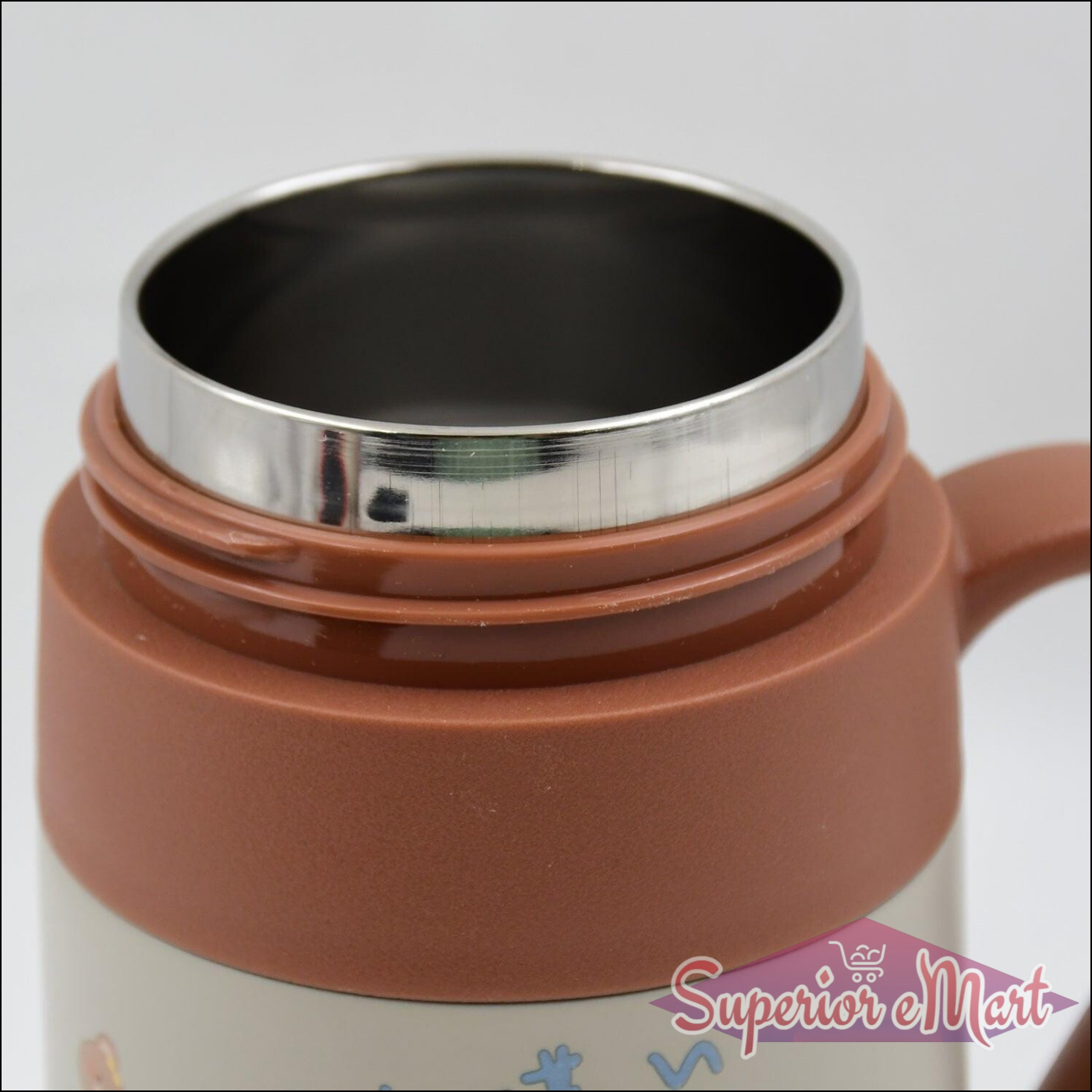 Close-up of a stainless steel vacuum insulated mug interior showing sleek design for optimal temperature retention