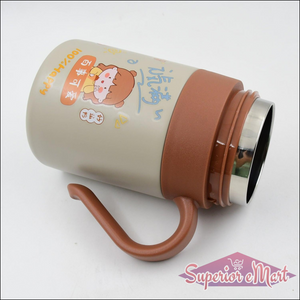 Cute stainless steel vacuum insulated mug with handle and playful design for beverages on the go