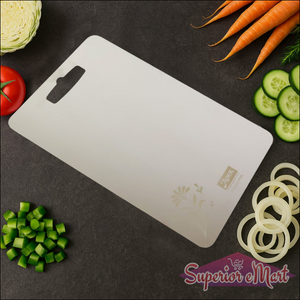 Superior eMart stainless steel chopping board on a kitchen counter with fresh vegetables