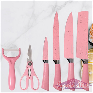 Stainless steel ceramic knife set in pink, including peeler, scissors, and various knives for kitchen use