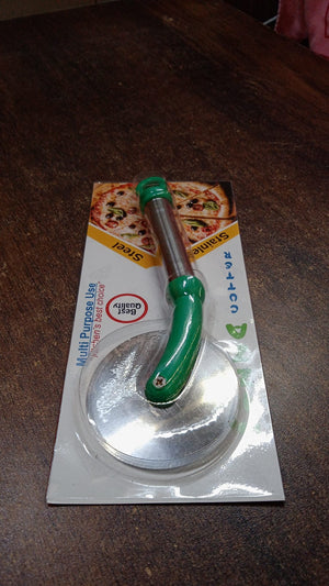 Stainless steel pizza cutter with a green handle packaged for easy use in the kitchen