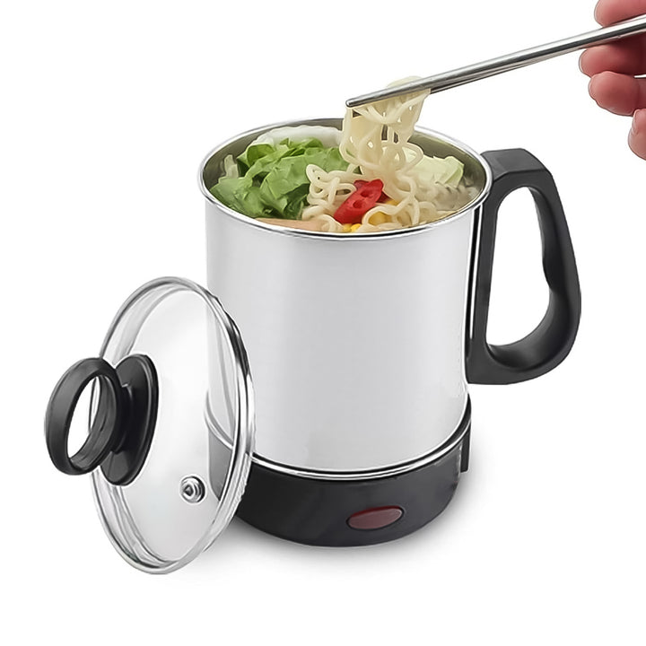 Electric stainless steel soup pot with lid and steaming vegetables, perfect for quick meals