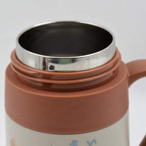 Close-up of a stainless steel vacuum insulated mug interior showing sleek design for optimal temperature retention