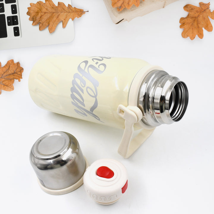 Superior eMart stainless steel vacuum insulated water bottle in cream with a removable cap and lid