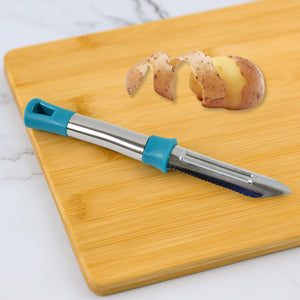 Superior eMart stainless steel vegetable peeler with ergonomic handle for easy peeling on bamboo board