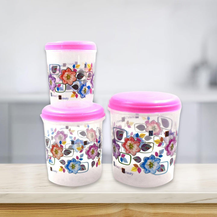 3 piece storage container set with vibrant floral designs and pink lids for kitchen organization