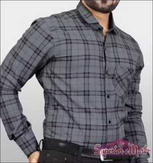 Gray plaid shirt worn by a person on a plain background