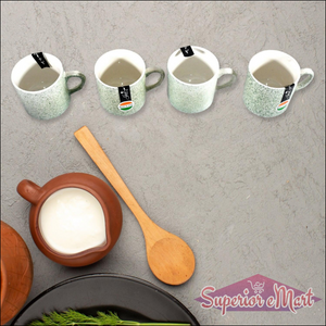Ceramic tea cups with snacks platter set featuring stylish mugs and a wooden spoon for serving