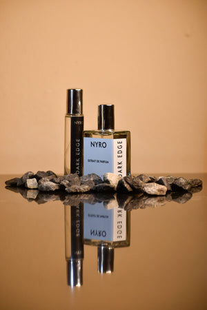 Nyro Dark Force Duo Perfume Set Featuring Two Elegant Bottles on Stone Display