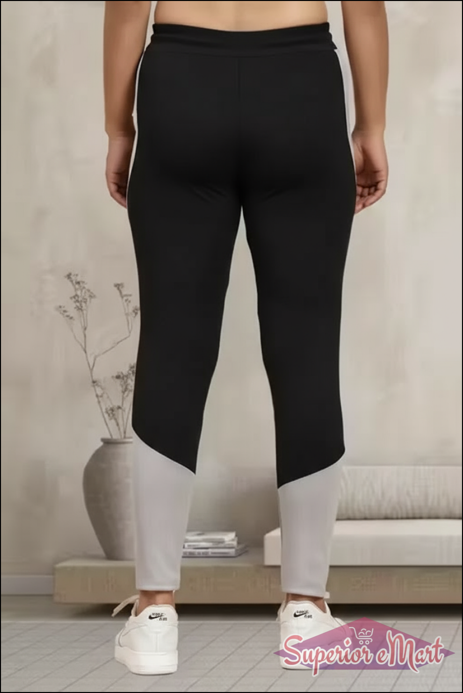 Back view of women's multicolor jeggings featuring black and gray colorblock design for comfort and style