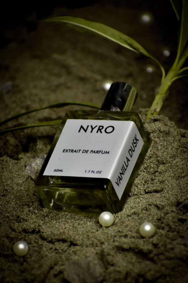 Nyro Vanilla Dusk Extrait de Parfum 60ml bottle with elegant design on sandy background