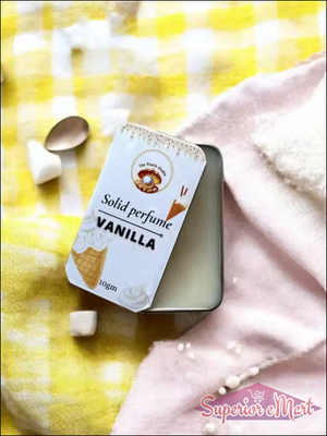 10g Vanilla solid perfume tin by The Pearls Studio with ice cream art, on yellow gingham and pink soft fabrics.