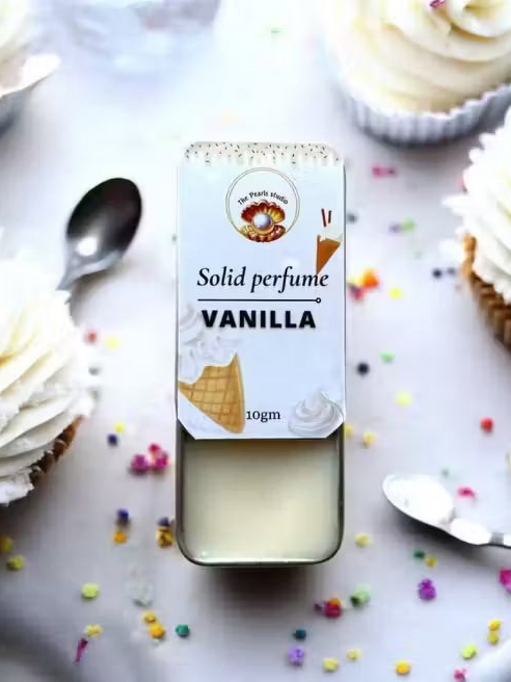 The Pearls studio 10gm Vanilla Solid Perfume in a sliding tin, showing cream balm. White label with ice cream theme.