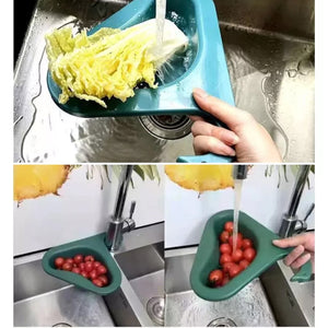 Swan kitchen drain strainer in use, catching vegetables and fruits while draining water in a sink