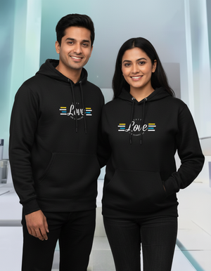 Two people wearing black hoodies with a design on a light background