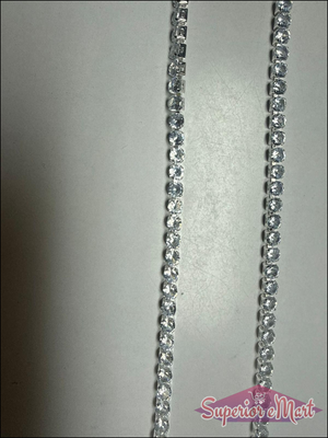 Two silver-toned strands of a tennis necklace with closely set, round, clear brilliant-cut stones.