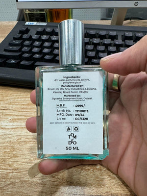 34 Boulevard Germain perfume bottle 50 ml with silver cap held in hand showing label and ingredients