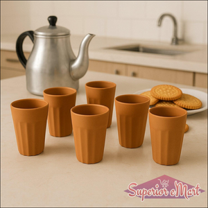 Traditional chai cups set of six in terracotta, perfect for enjoying tea, with a teapot and snacks in the background