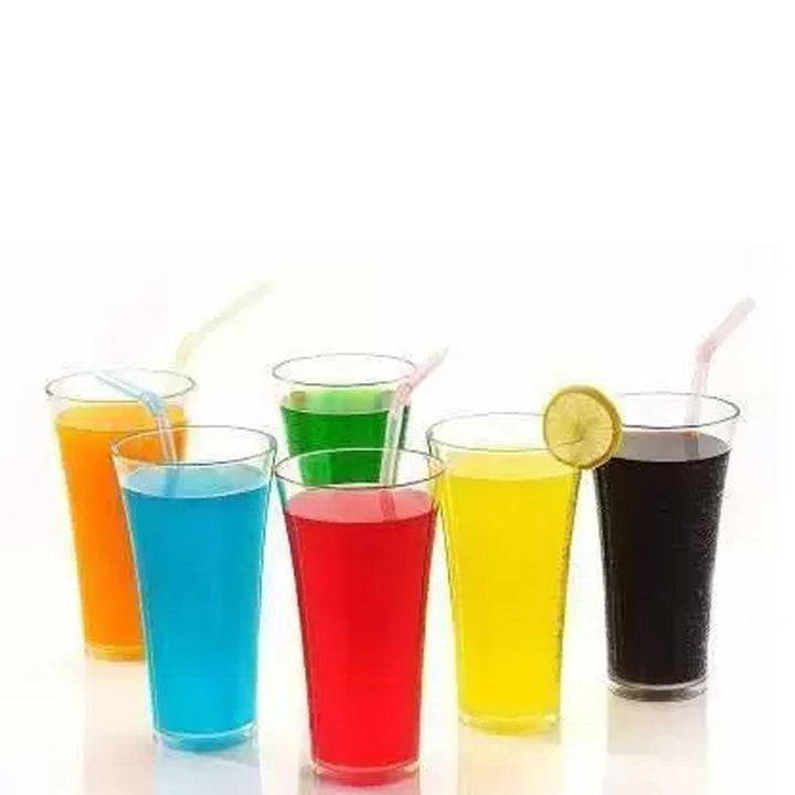 Vibrant transparent juice glass set with colorful drinks and straws for entertaining guests