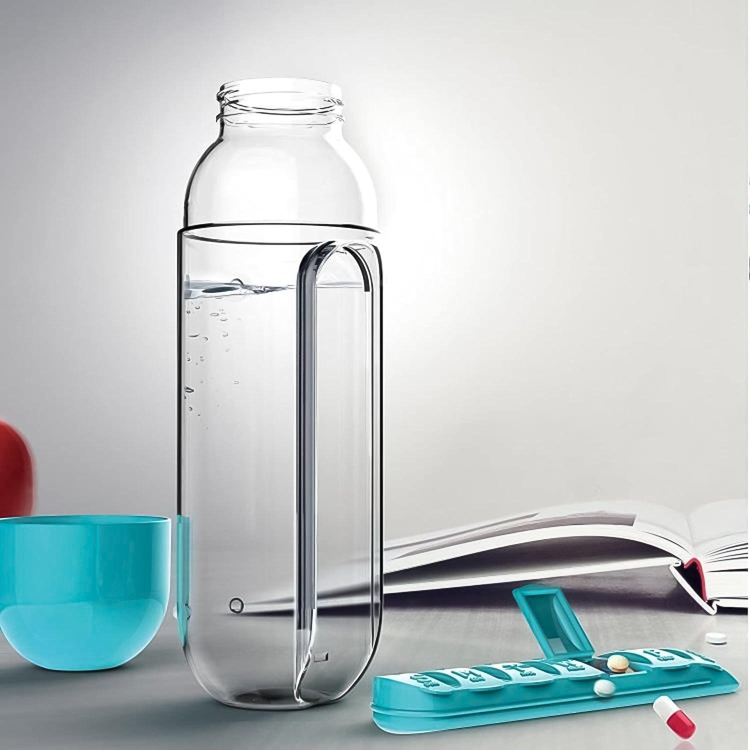 Clear travel pill water bottle with a compartment for pills and a blue cup for on-the-go convenience
