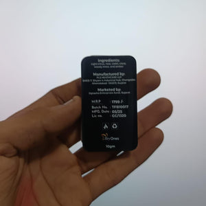 Hand holding ancient style solid perfume in black compact container by Superior eMart showing label details