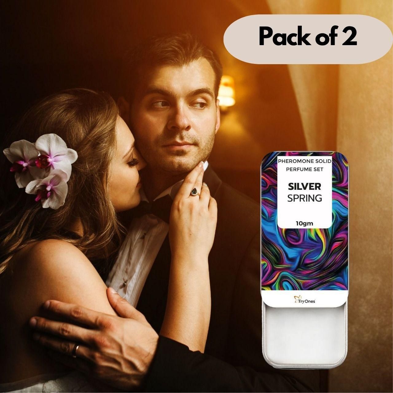Silver Spring pheromone solid fragrance pack of 2 with colorful packaging next to romantic couple