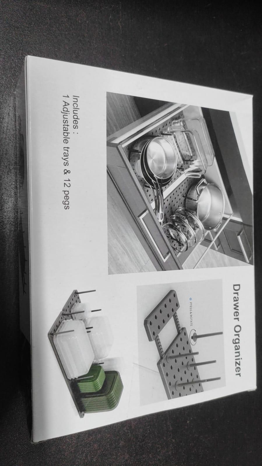 Adjustable pegboard dish rack drawer organizer with 14 trays and 12 pegs for kitchen storage