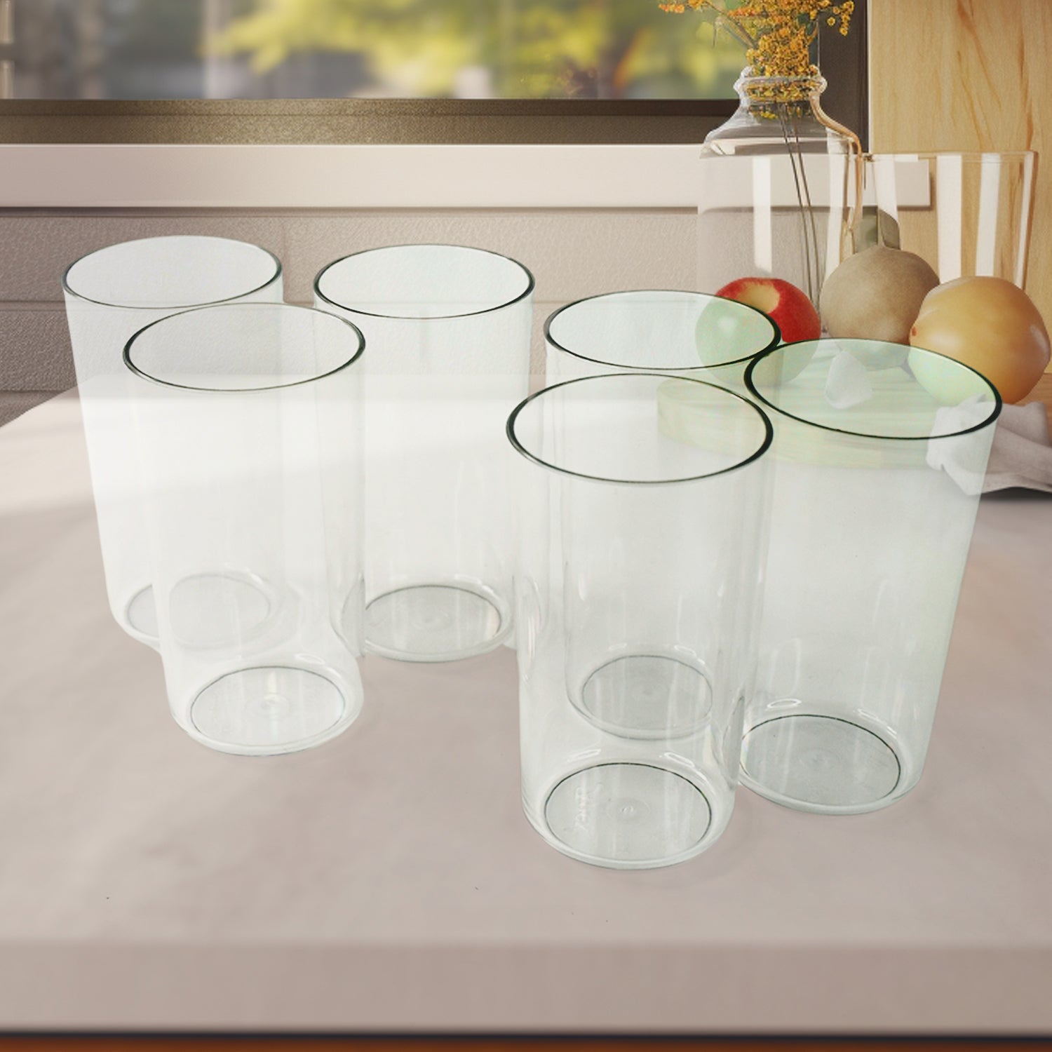 Set of Superior eMart unbreakable glass set with six durable, clear drinking glasses on a kitchen counter