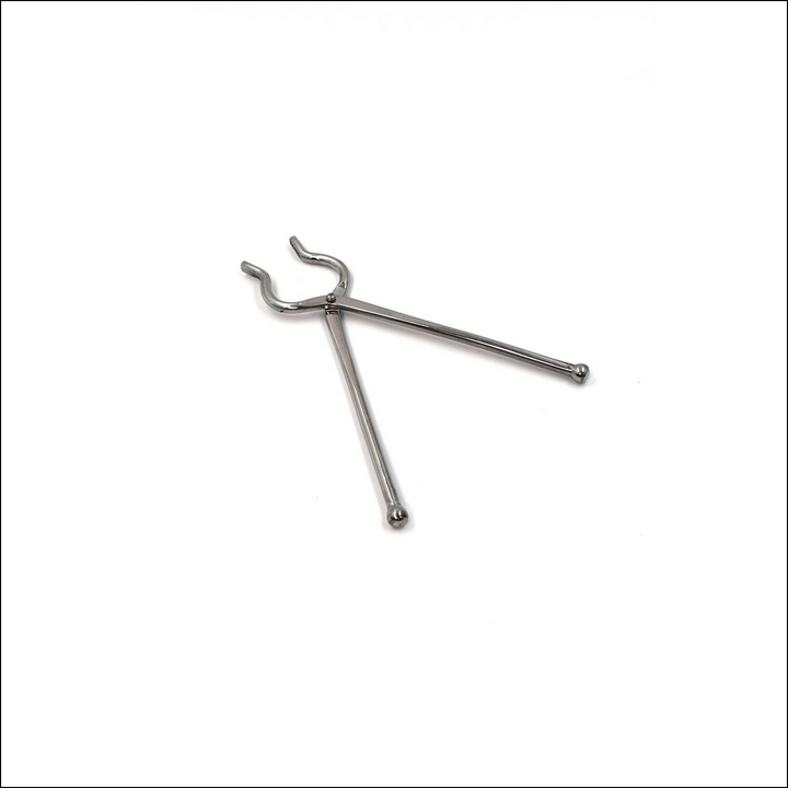 Stainless steel utensil holder tongs featuring durable and sleek design for kitchen use