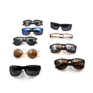 Assorted UV protection sunglasses for men and women in various styles and colors on display