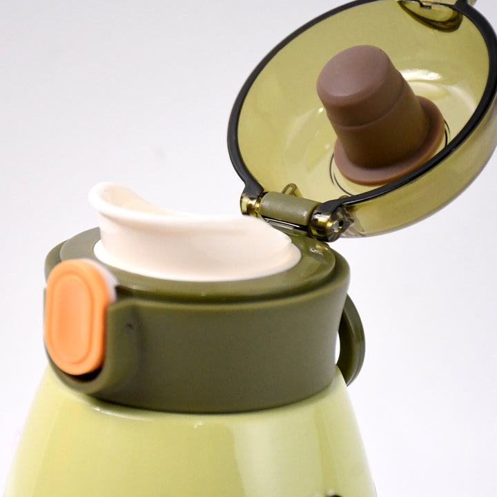 Close-up of vacuum insulation flask bottle with open lid and silicone spout for easy sipping