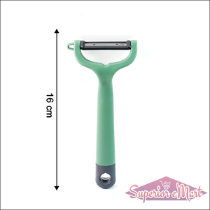 Green vegetable fruit peeler with ergonomic handle for easy peeling in the kitchen
