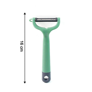 Green vegetable fruit peeler with ergonomic handle for easy peeling in the kitchen