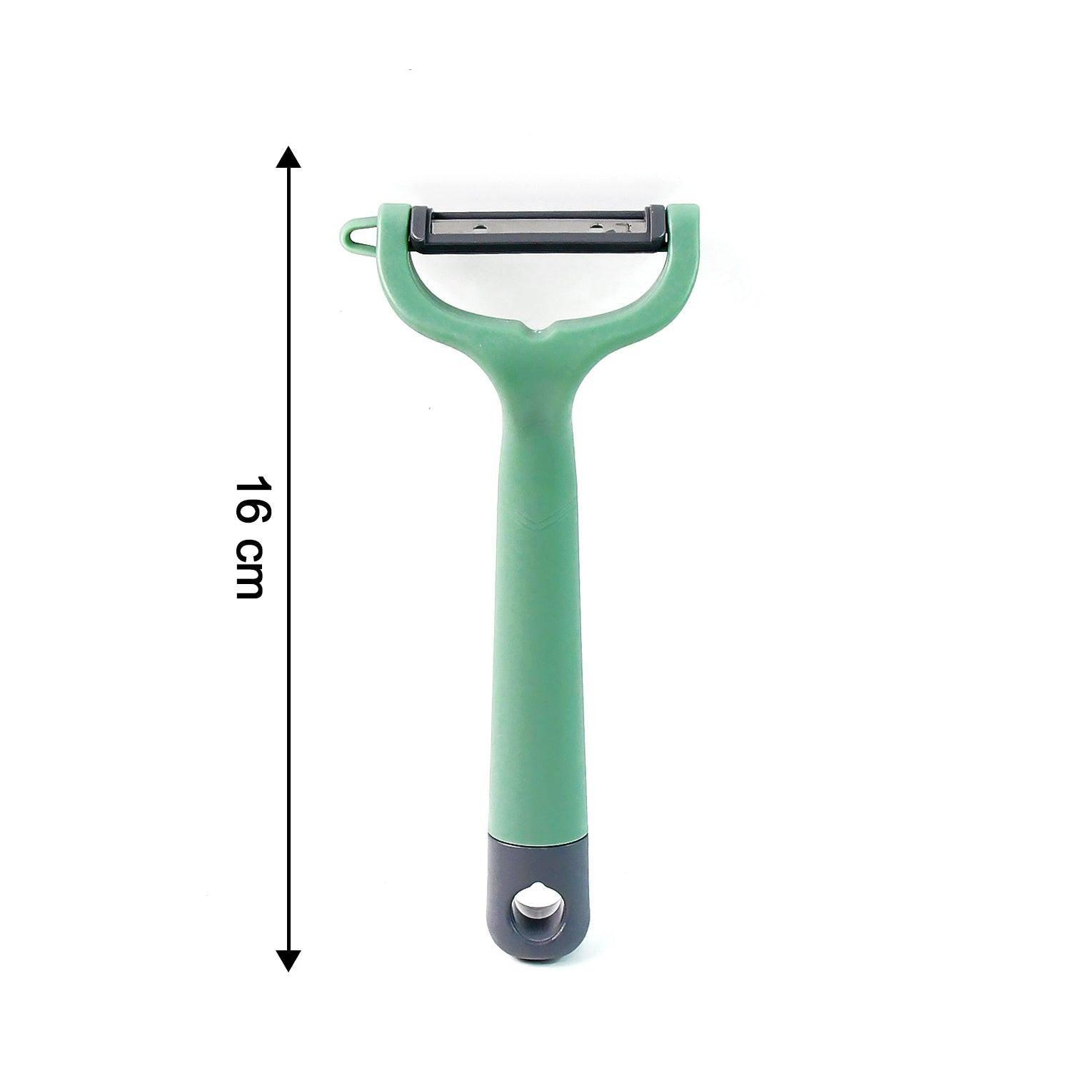 Green vegetable fruit peeler with ergonomic handle for easy peeling in the kitchen