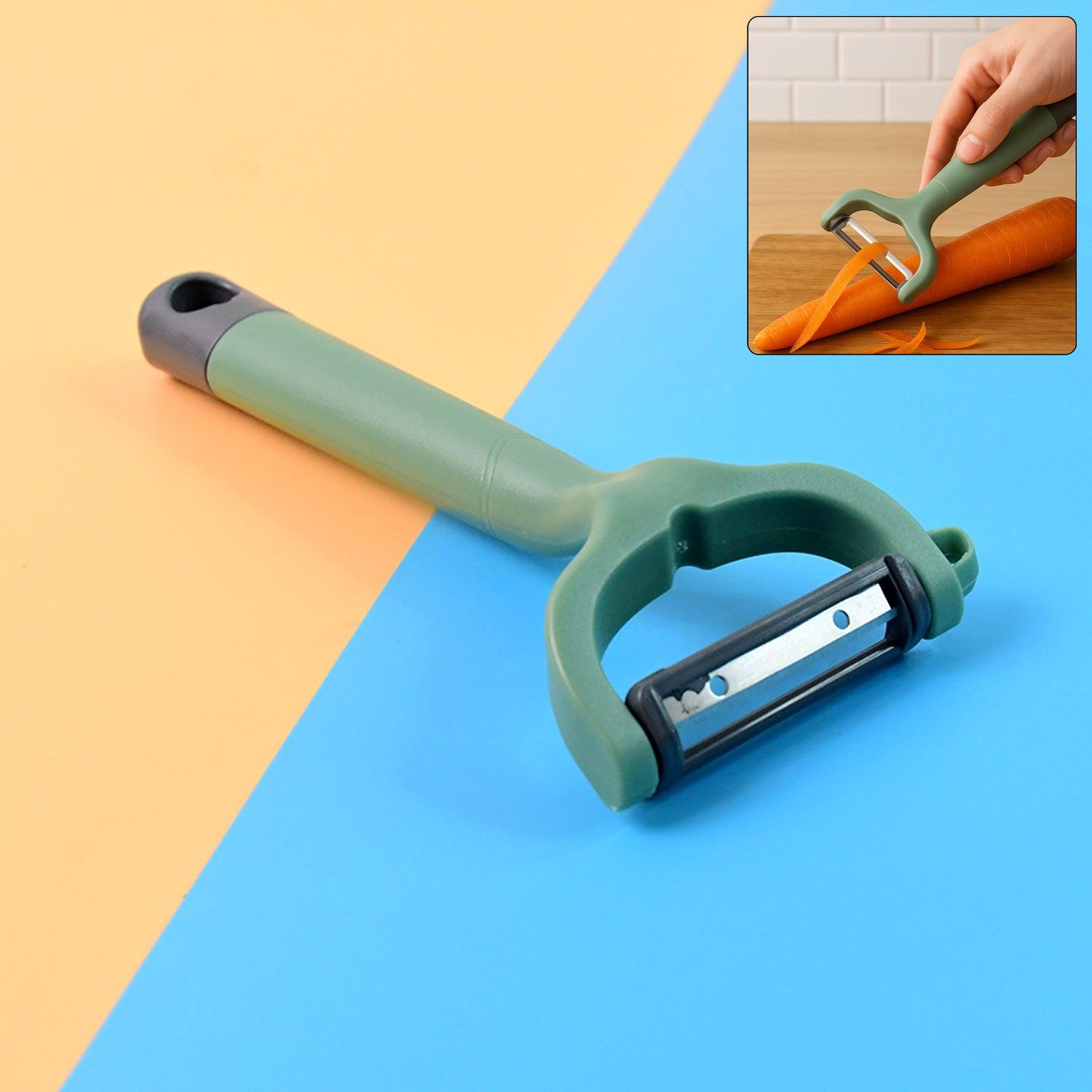 Green vegetable fruit peeler with ergonomic handle for easy peeling of carrots and other produce