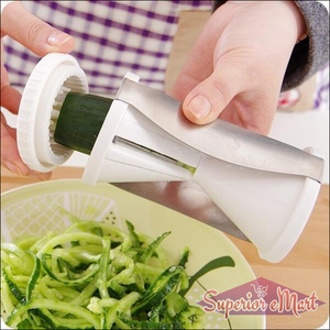 Superior eMart vegetable spiralizer slicer in use, creating spiralized cucumber noodles in a bowl