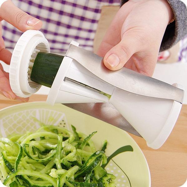 Superior eMart vegetable spiralizer slicer in use, creating spiralized cucumber noodles in a bowl