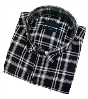 Folded black and white plaid shirt on a white background