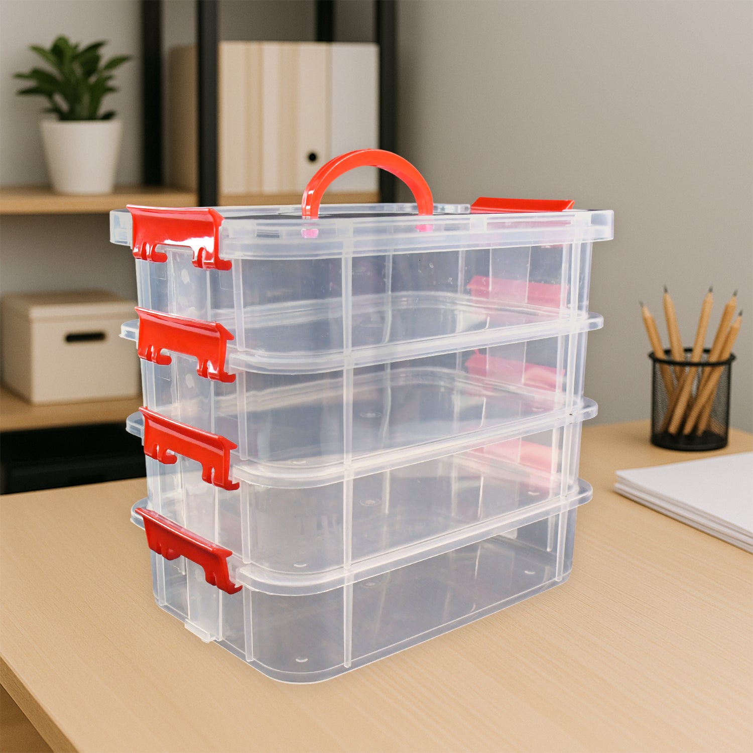 Superior eMart 4 layer plastic storage box with red clasps and handle on a wooden desk