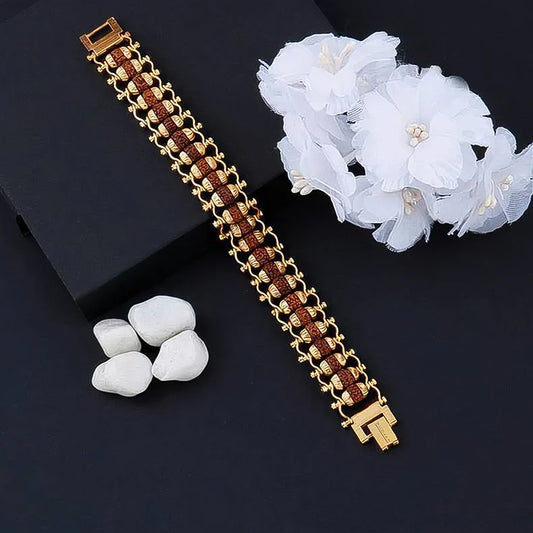 Golden Rudraksha Bracelet Rakhi with intricate design and elegant finish for festive occasions