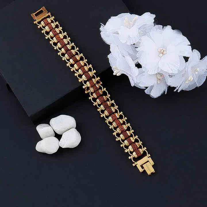 Golden Rudraksha Bracelet Rakhi with intricate design and elegant finish for festive occasions