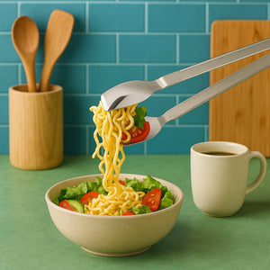 2-in-1 stainless steel serving tong grabbing noodles from a salad bowl in a kitchen setting