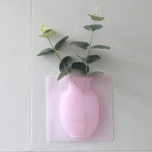 Wall mounted flower pot sticker in pink design with green plant for modern home decor