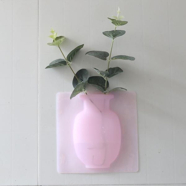 Wall mounted flower pot sticker in pink design with green plant for modern home decor