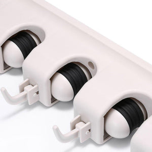 Wall mounted mop organizer with durable clips for efficient storage and organization in any garden or home